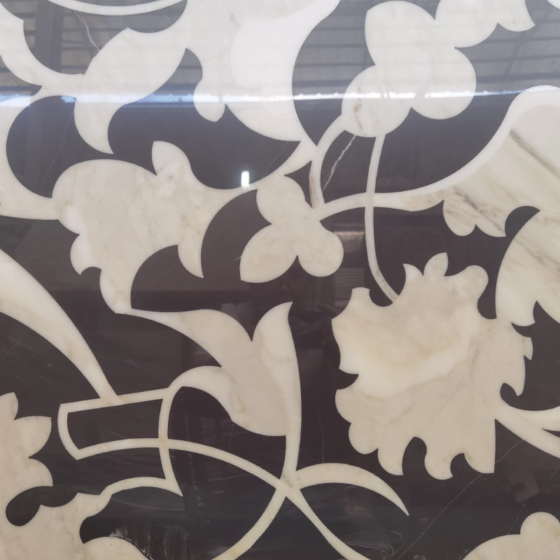 Main view of a bespoke floral waterjet medallion made from Calacatta White and Nero Marquina marble, showing high contrast patterns.