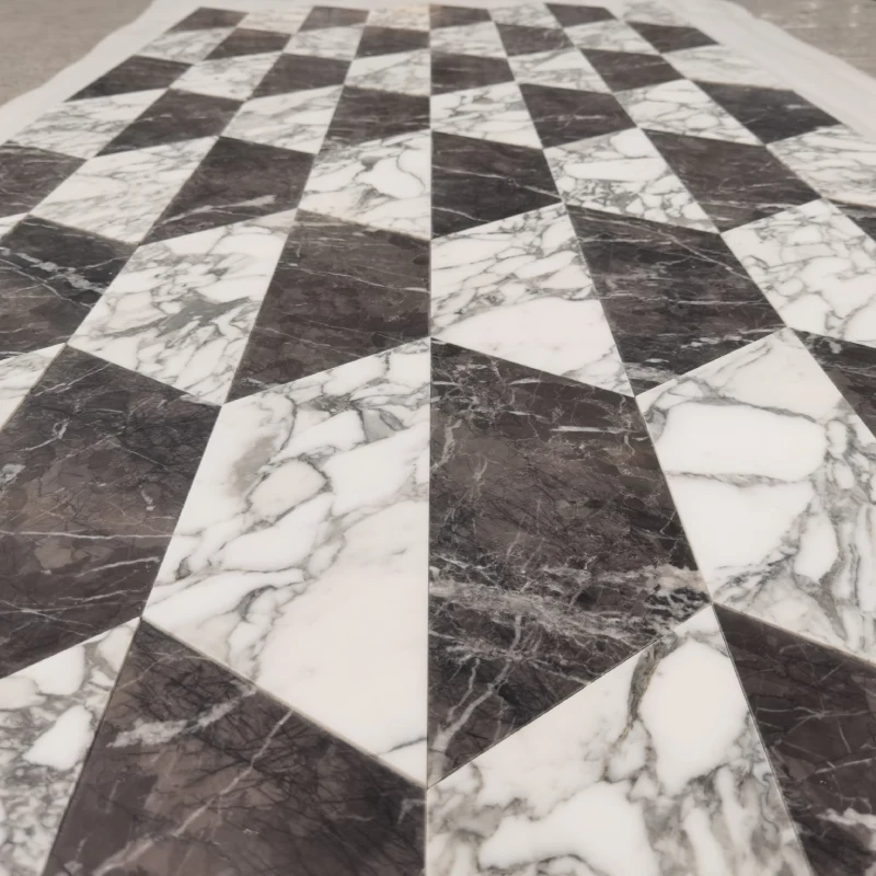 Multi-panel installation view of a modern geometric rhombus diamond lattice pattern flooring, using alternating modular tiles of Arabescato White marble and a dark grey composite stone (Italian Grey/Sintered Stone) for large-area paving.