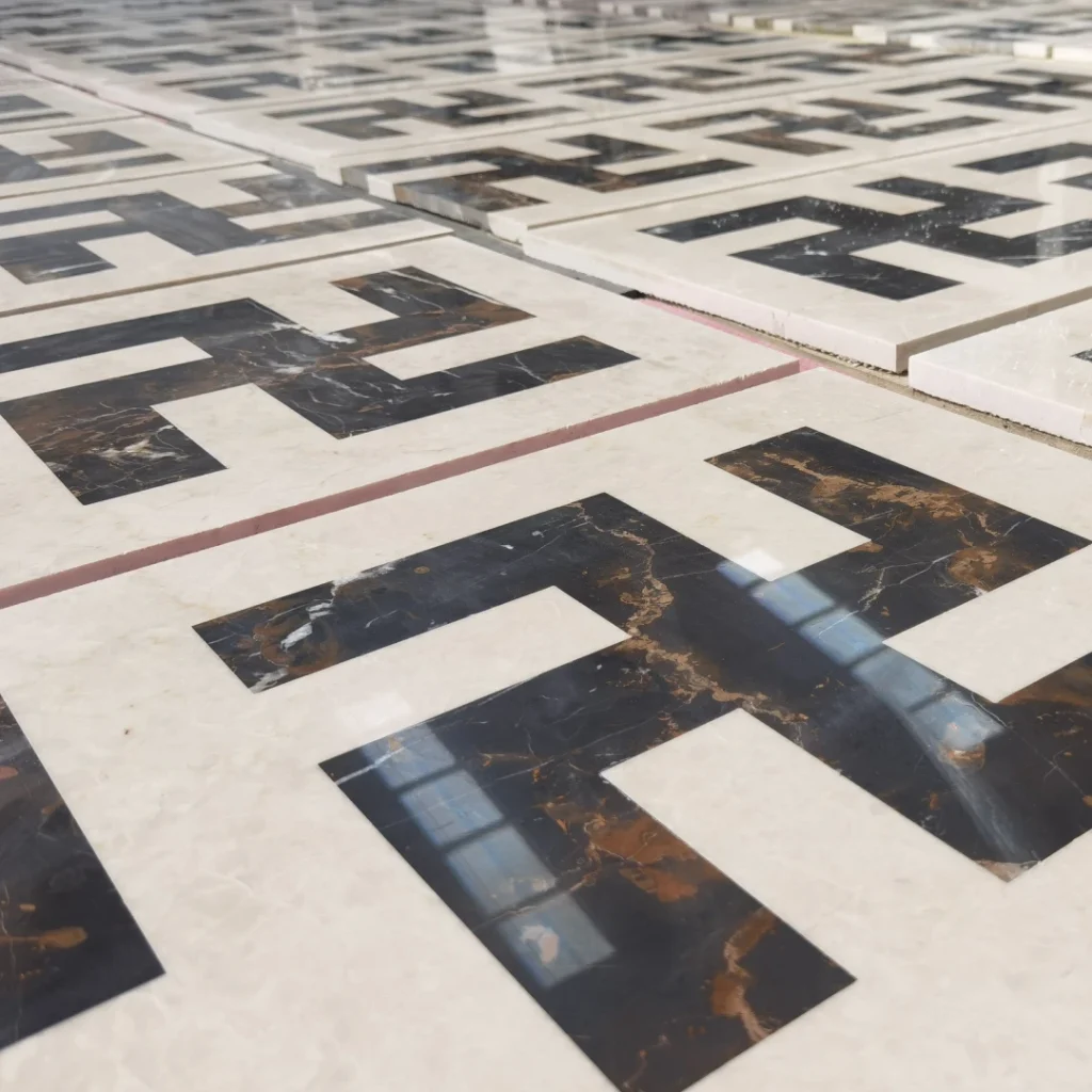Bespoke modern geometric Wanzi lattice pattern waterjet medallion using Ottoman Beige and Portoro black and gold marble, showing high-precision factory dry-lay for luxury architectural flooring.
