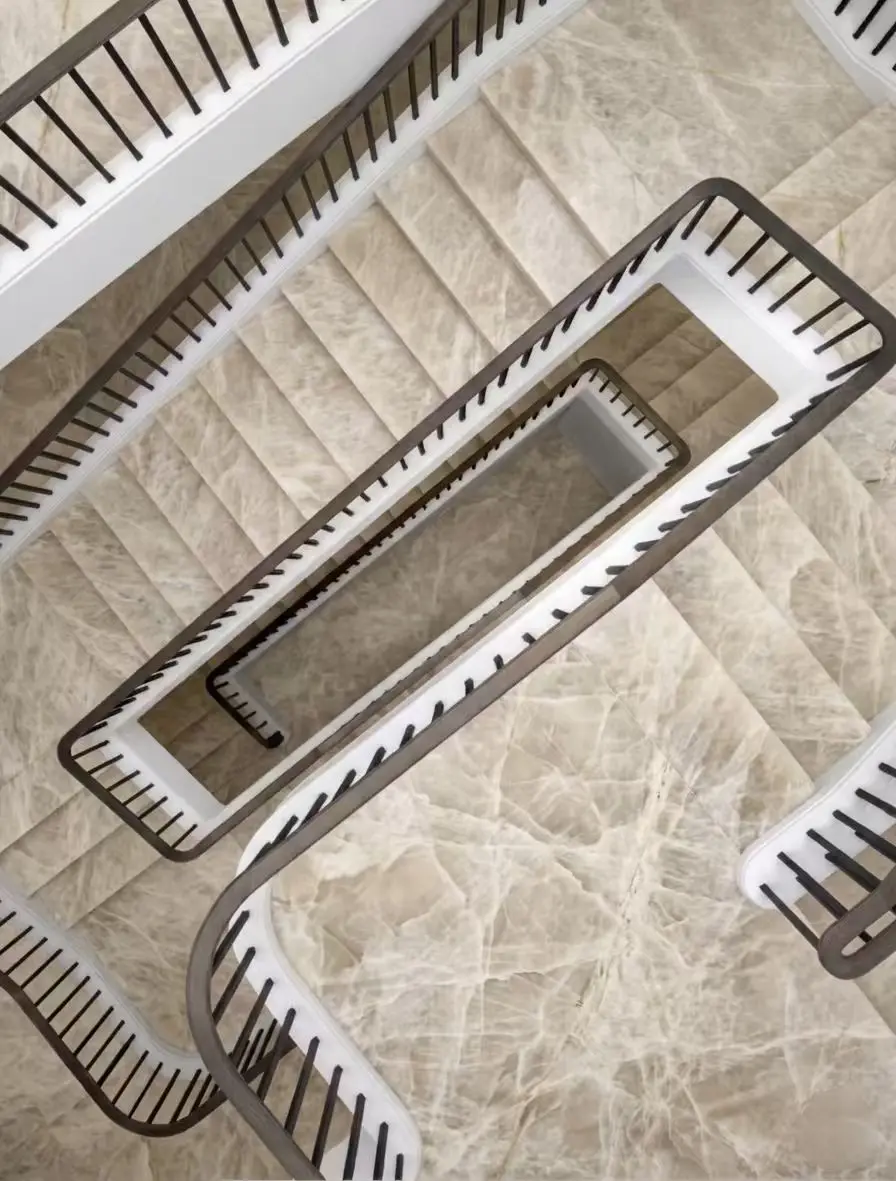 Top view of custom natural marble stairs with continuous veining for luxury residential staircase design